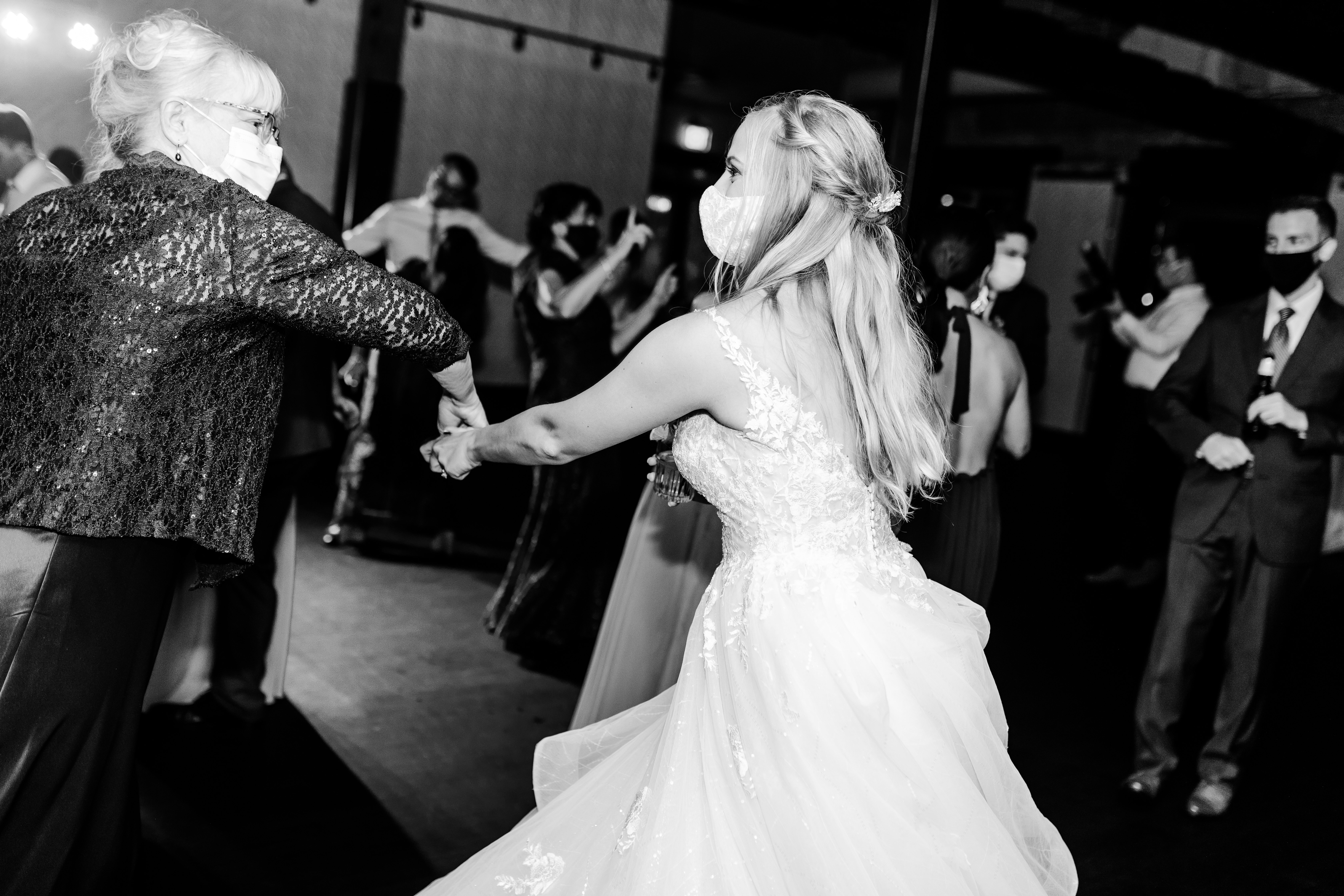 Bride dancing with mom on dance floor at intimate wedding