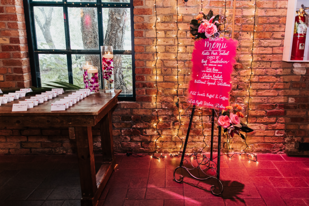 hot pink wedding menu sign escort card table