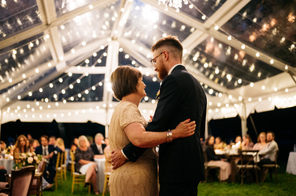 mother son dance under clear top tent