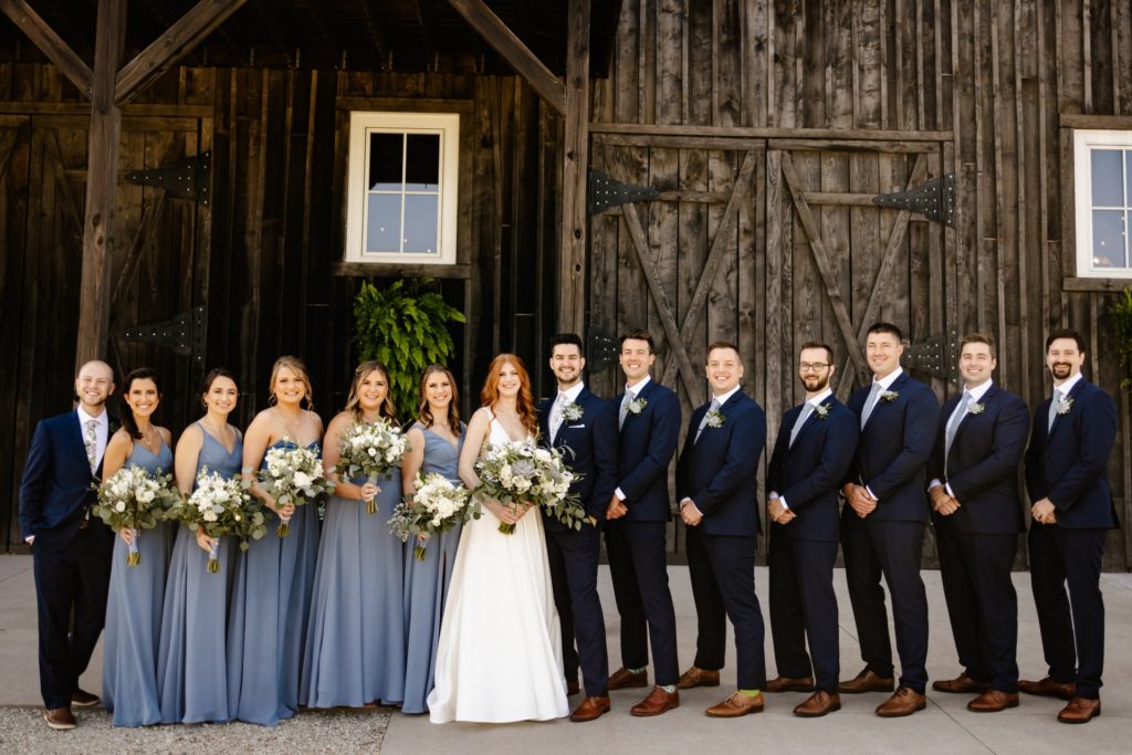bridal party dusty blue dresses dark blue suits