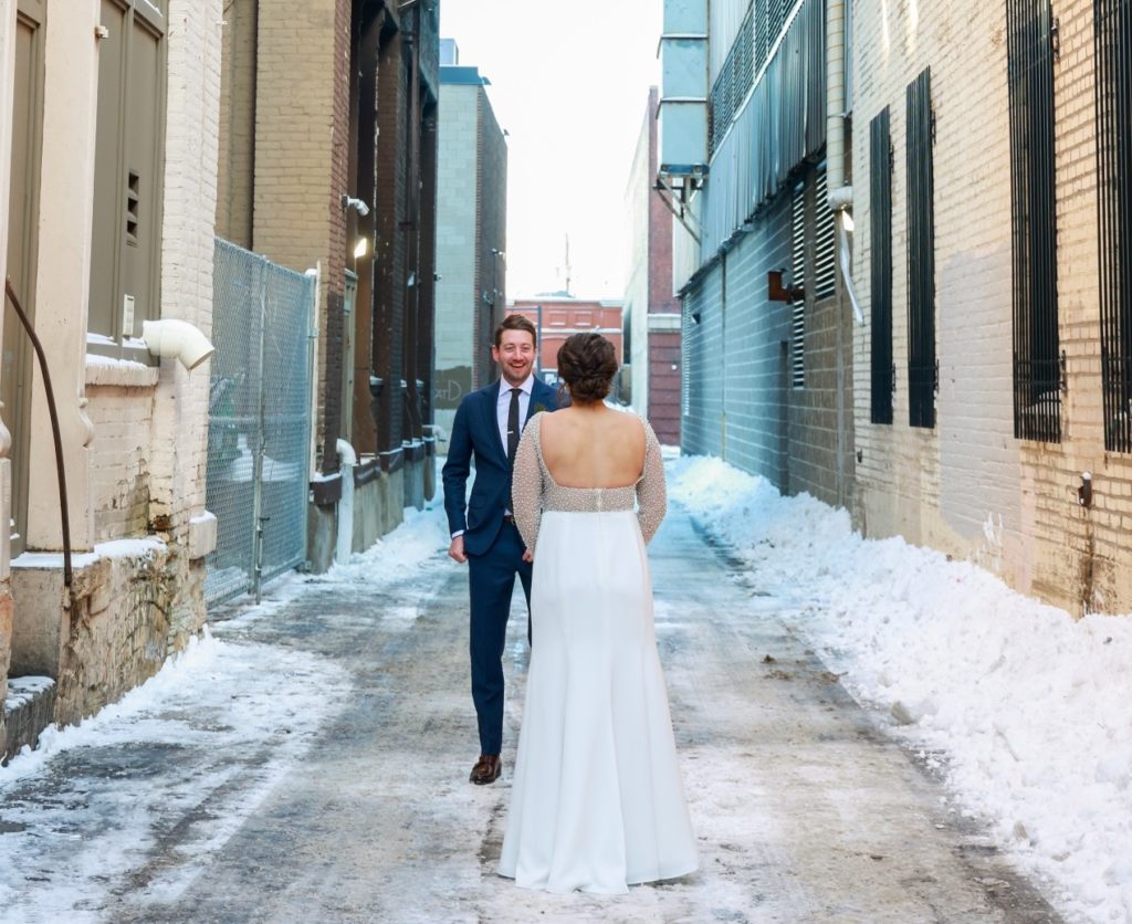 bride and groom first look reaction winter outdoors