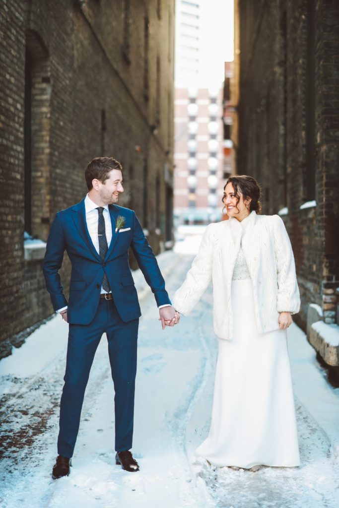 Bride and groom portrait alleyway Minnesota winter wedding