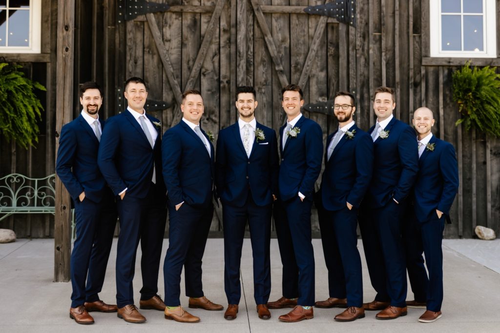 groomsmen group photo dark blue suits