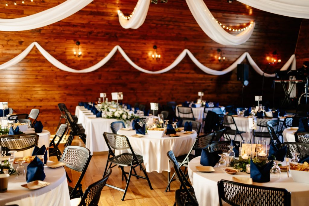 barn wedding venue reception dinner white draping