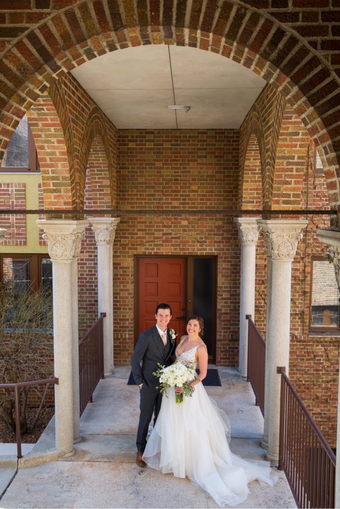 bride and groom portrait brick
