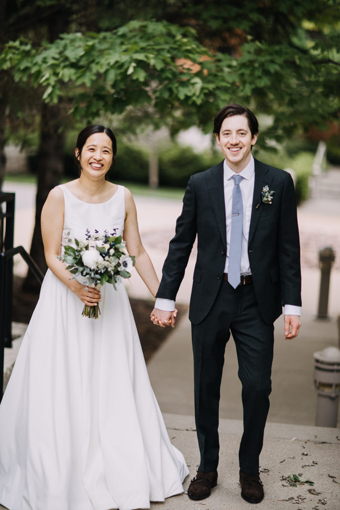 bride and groom holding hands portrait