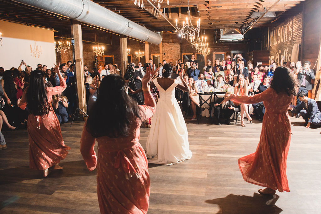 bride and bridesmaids cultural wedding dance off