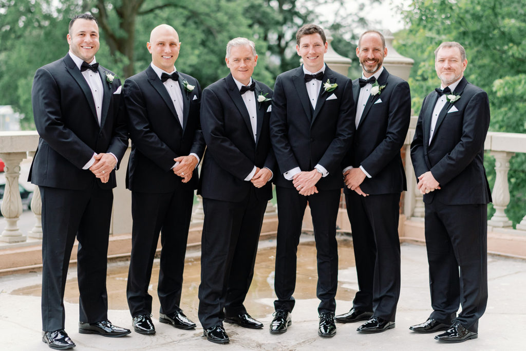 groomsmen sleek black suits - timeless wedding attire