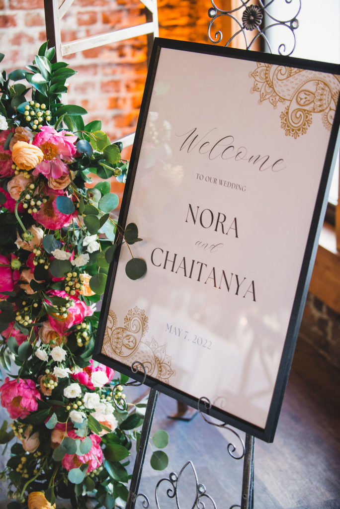 wedding welcome sign with colorful florals