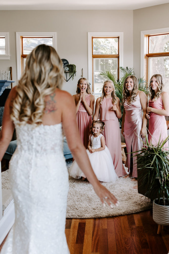 bride first look with daughters bridesmaids reaction