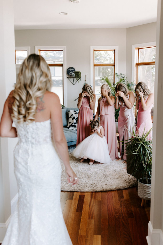 bride first look with daughters bridesmaids