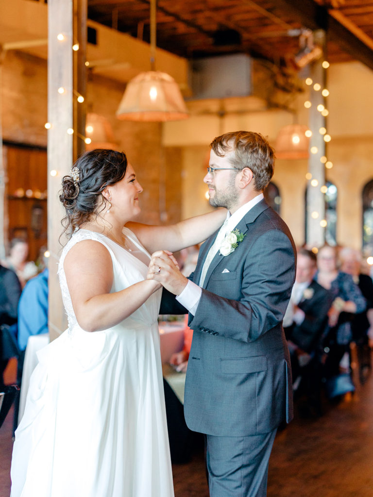 bride and groom romantic first dance at aster cafe wedding
