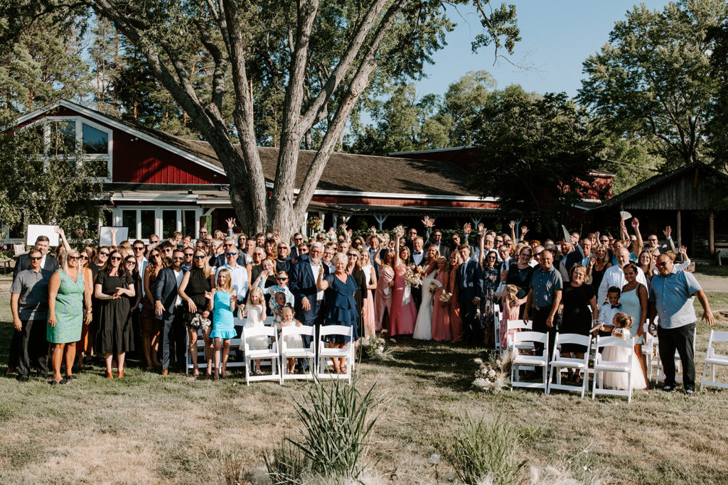 Wedding photo with all guests at ceremony site at Cast & Cru