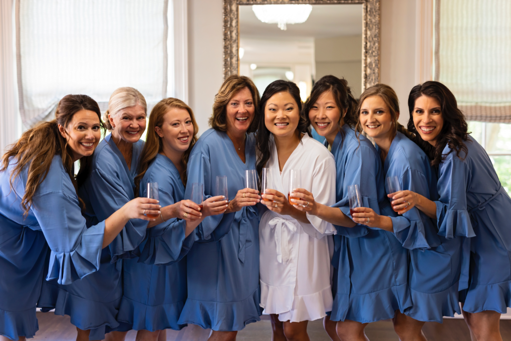 Ladies getting ready in blue robes wedding morning