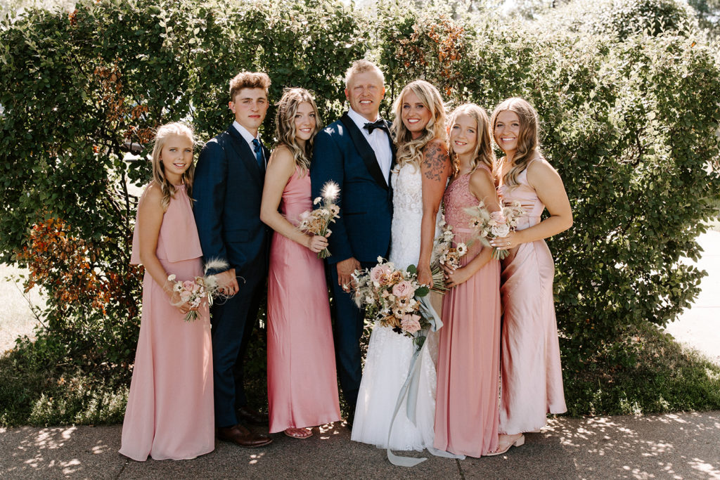 Wedding party group photo - pink dresses and blue suits