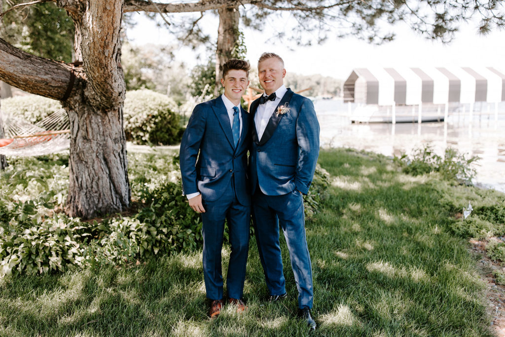father and son wedding day groomsman in blue suits
