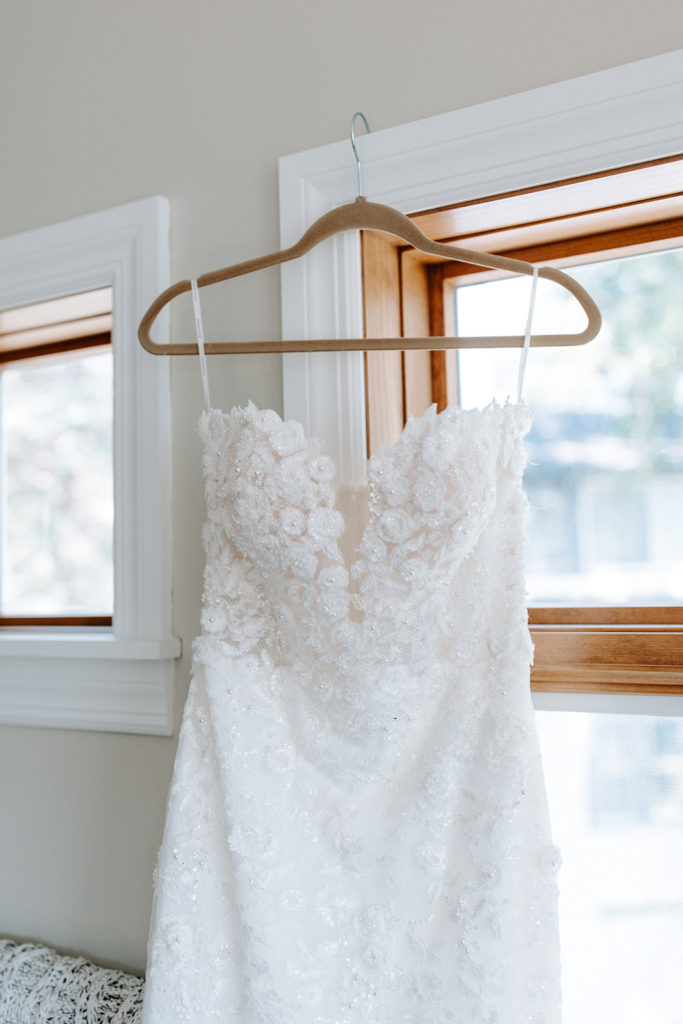 strapless lace wedding dress hanging