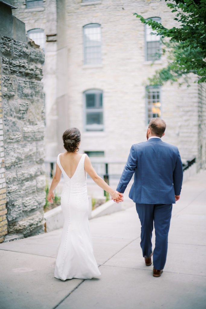 bride-groom-walking-holding-hands