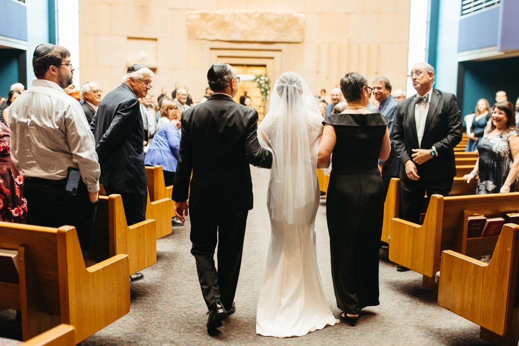 bride-escorted-by-parents-jewish-wedding-ceremony