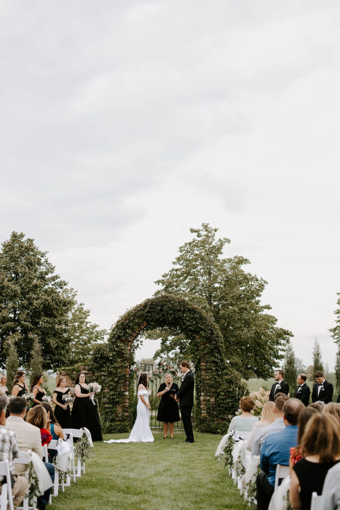 bride-groom-ourdoor-ceremony-redeemed-farm-minnesota-barn