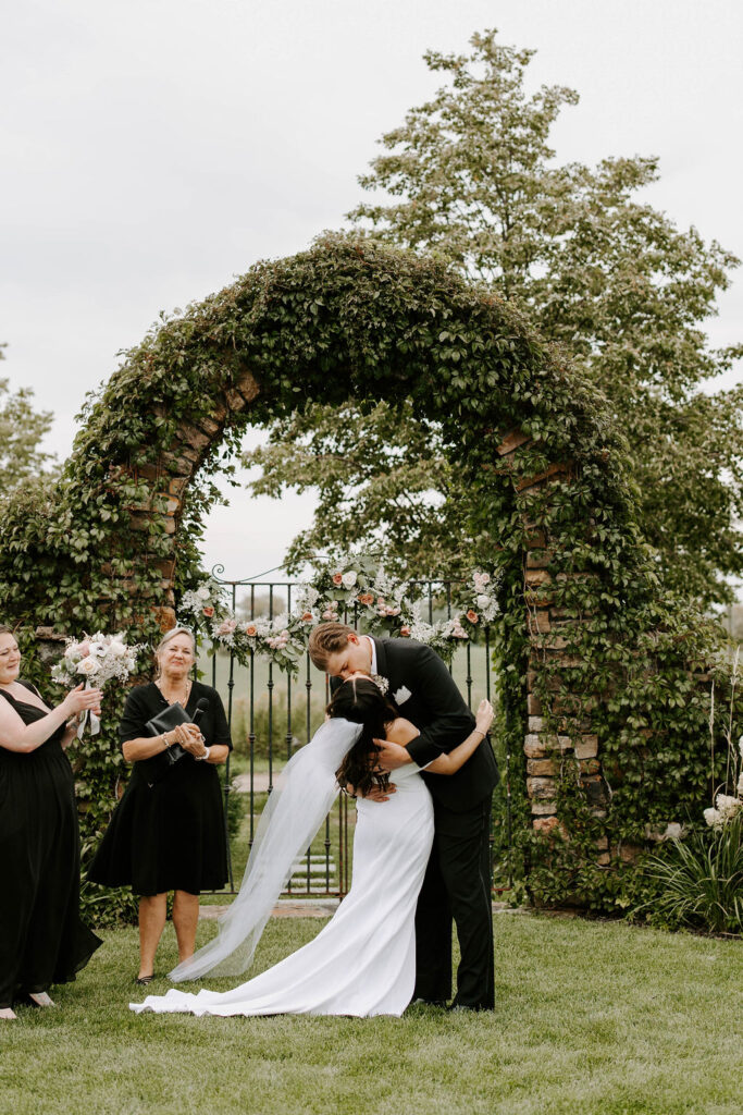 bride-groom-outdoor-ceremony-dip-kiss