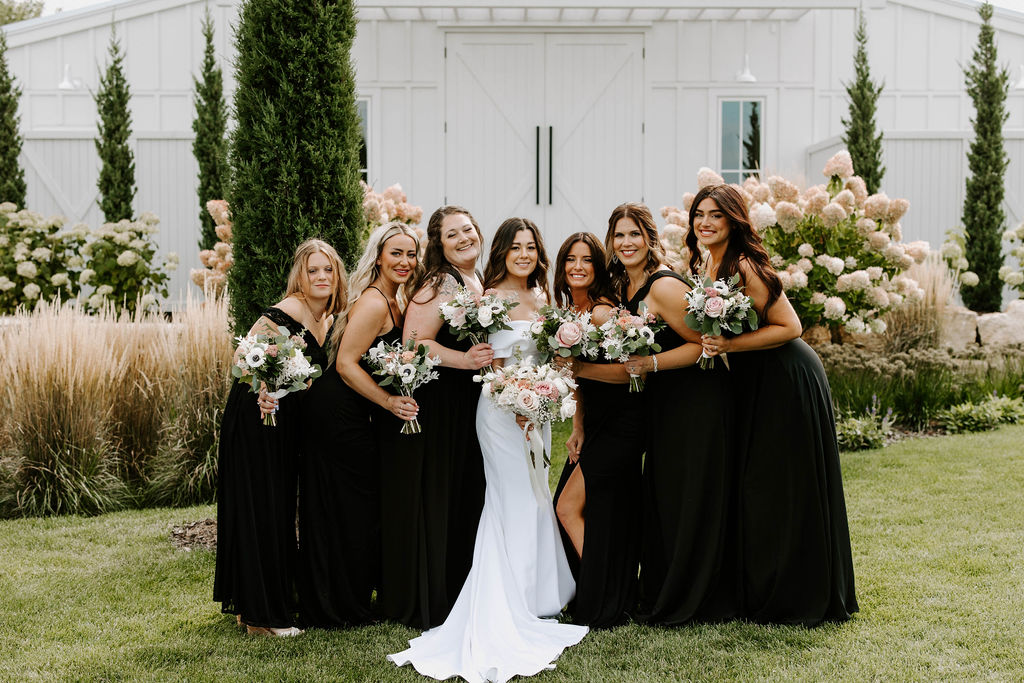 bridesmaid-group-photo-black-dresses-blush-pink-bouquet
