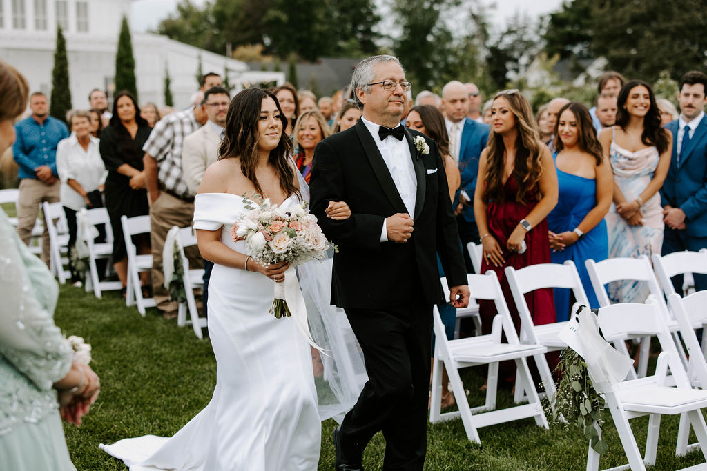 bride-escorted-down-aisle-by-dad-outdoor-ceremony