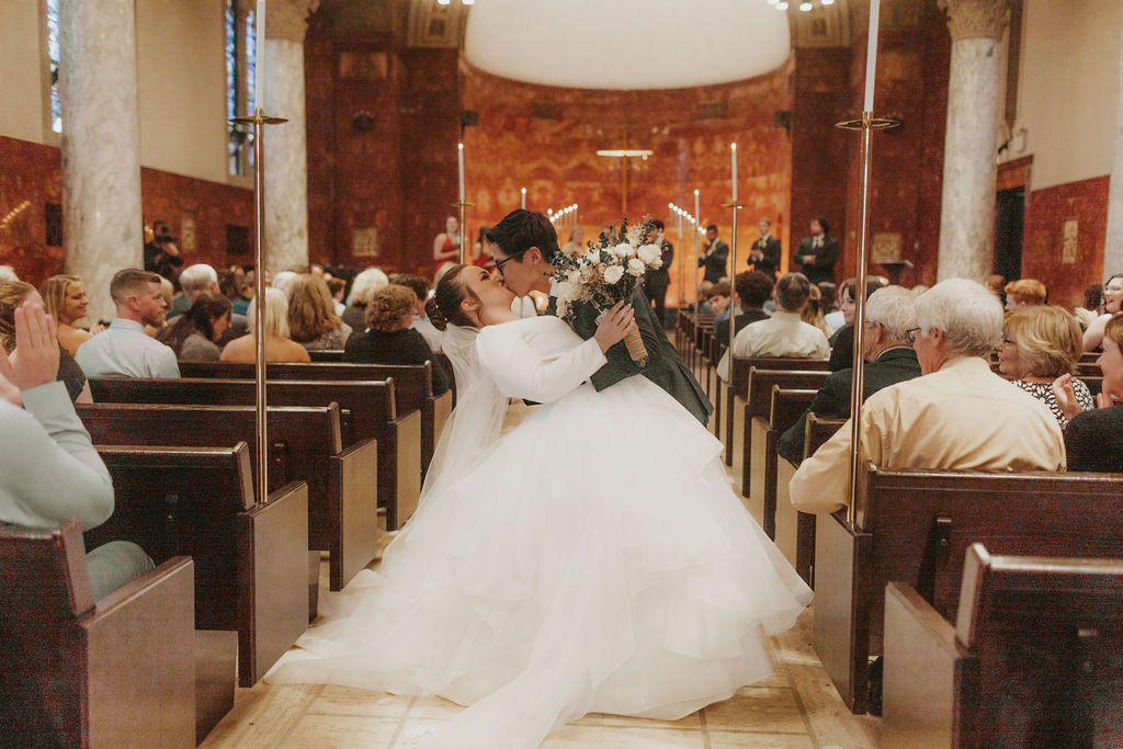 bride-groom-kiss-chapel-wedding-exit-university-of-northwestern-wedding