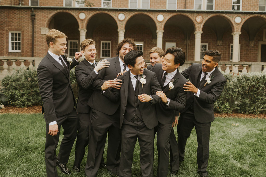 groomsmen-candid-laughing-tackle-groom