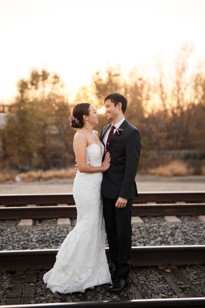 bride-groom-portraits-sunset-train-tracks