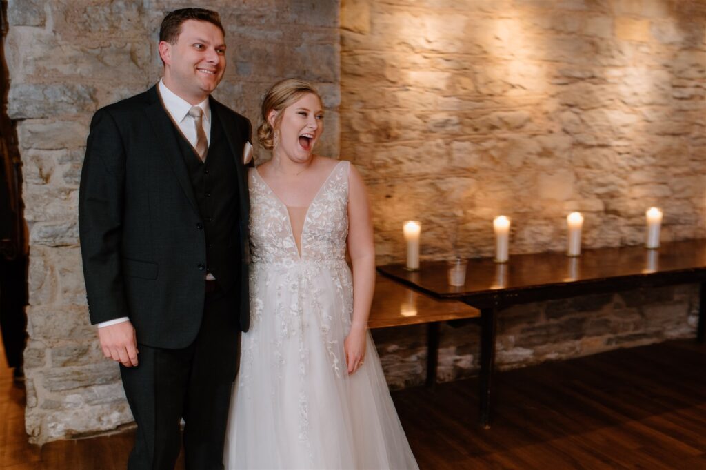 bride and groom reaction to reception room reveal