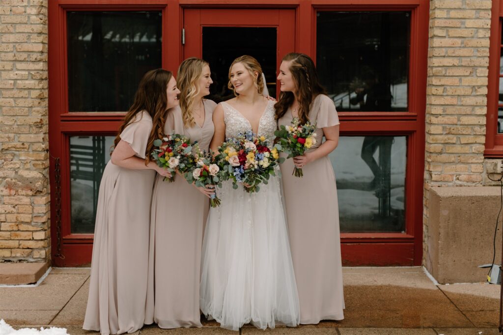 neutral bridesmaids dresses with colorful bouquets