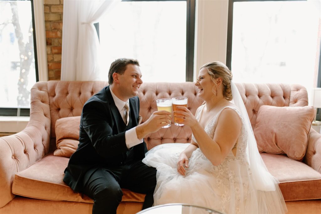 bride and groom cheers at colorful st Anthony main wedding