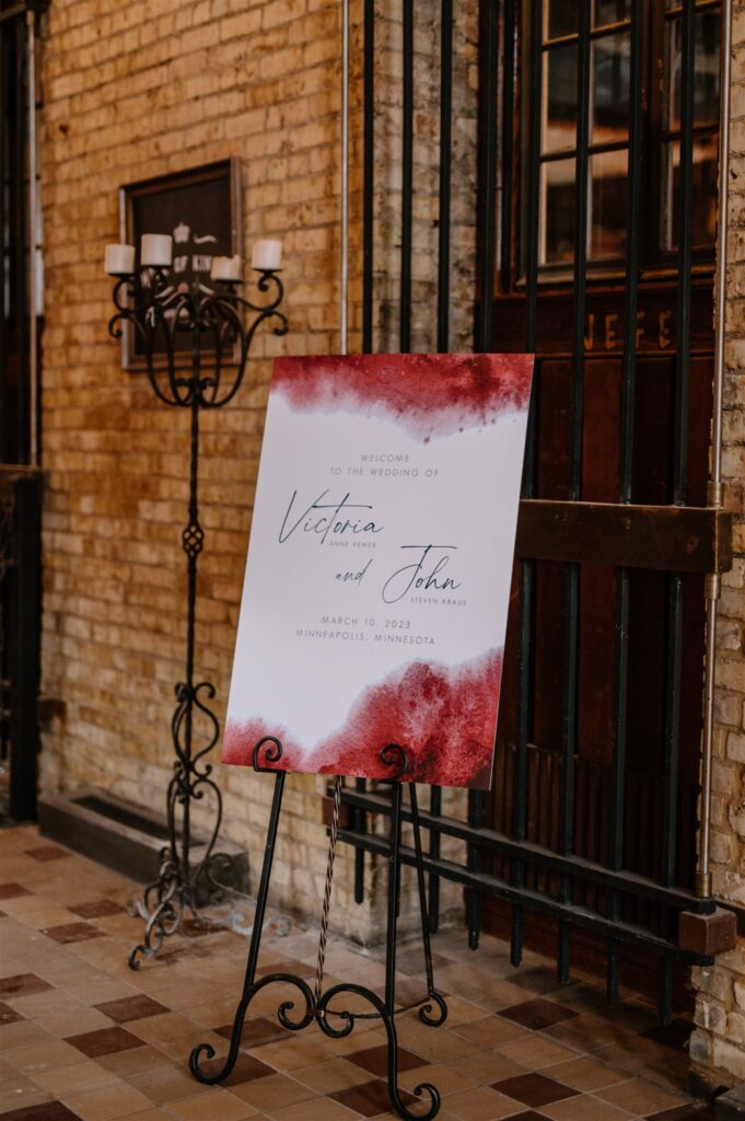 red wedding welcome sign at colorful st Anthony main wedding