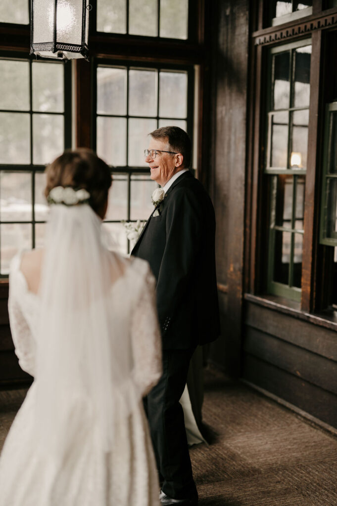 bride first look with dad at Theodore Wirth Chalet