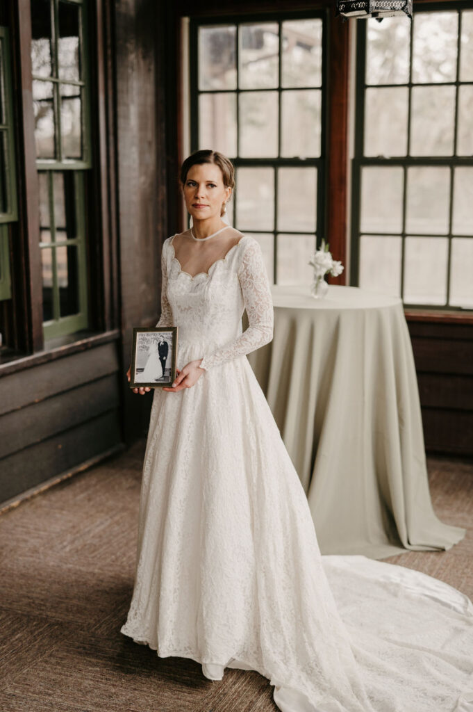 bride portrait in grandmothers wedding dress with old wedding photo