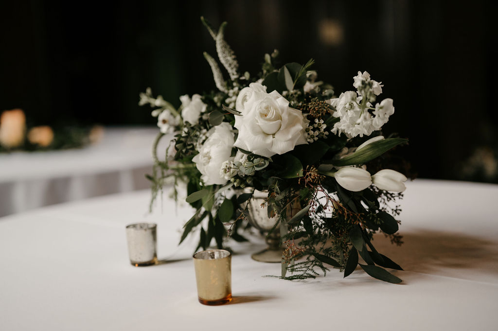 simple wedding reception table decor white flowers at Theodore Wirth Chalet