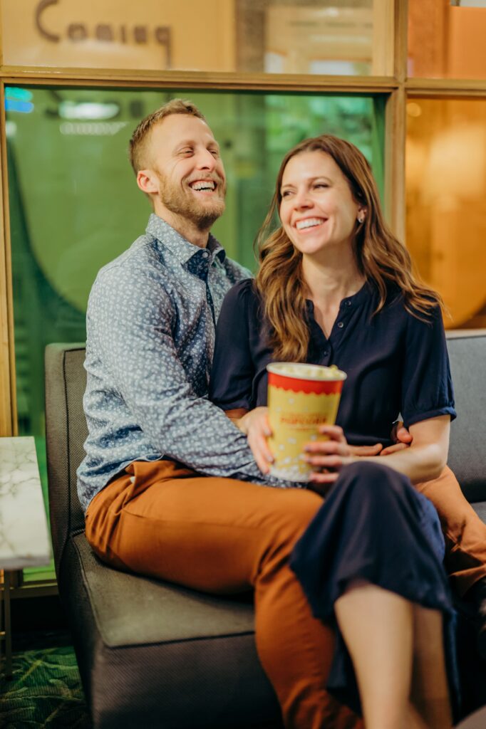 movie theater engagement photos with popcorn