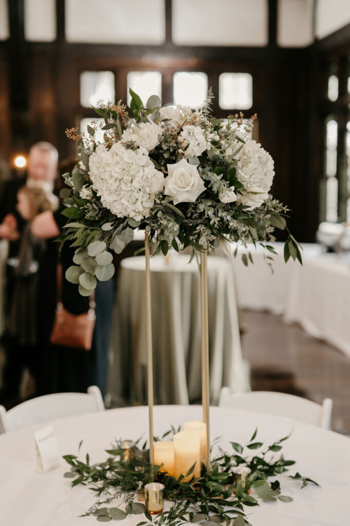 tall wedding reception table arrangement white florals at Theodore Wirth Chalet