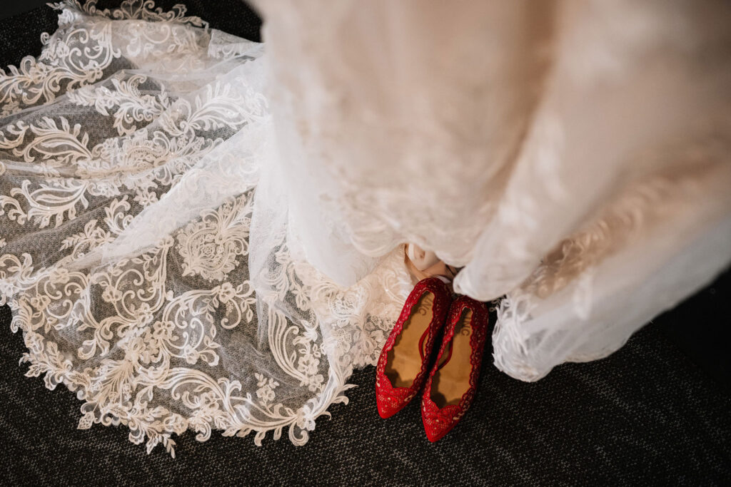bridal details - red heels and lace dress