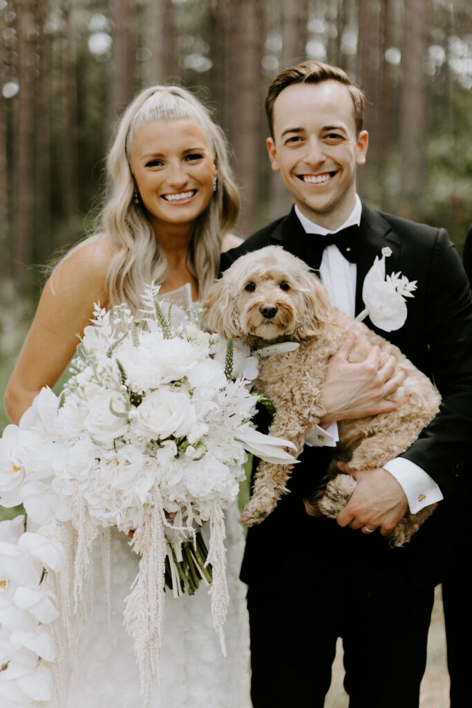 bride and groom portrait with dog at Pinewood in MN