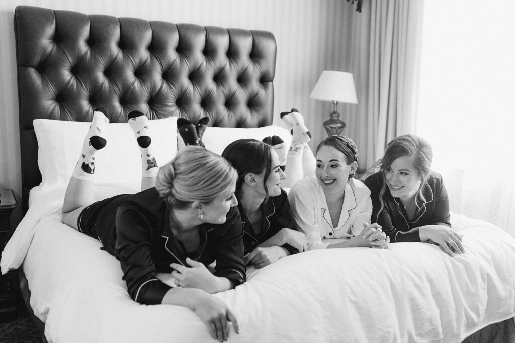 bridesmaids getting ready hotel room bed