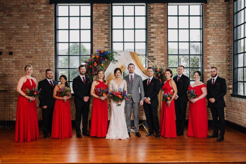 wedding party colorful red attire at Essence Event Center