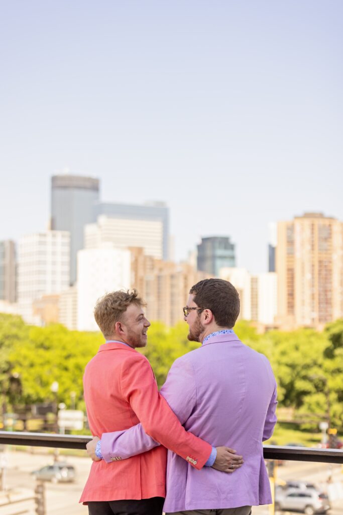 grooms wedding portrait overlooking Minneapolis skyline at walker art center wedding