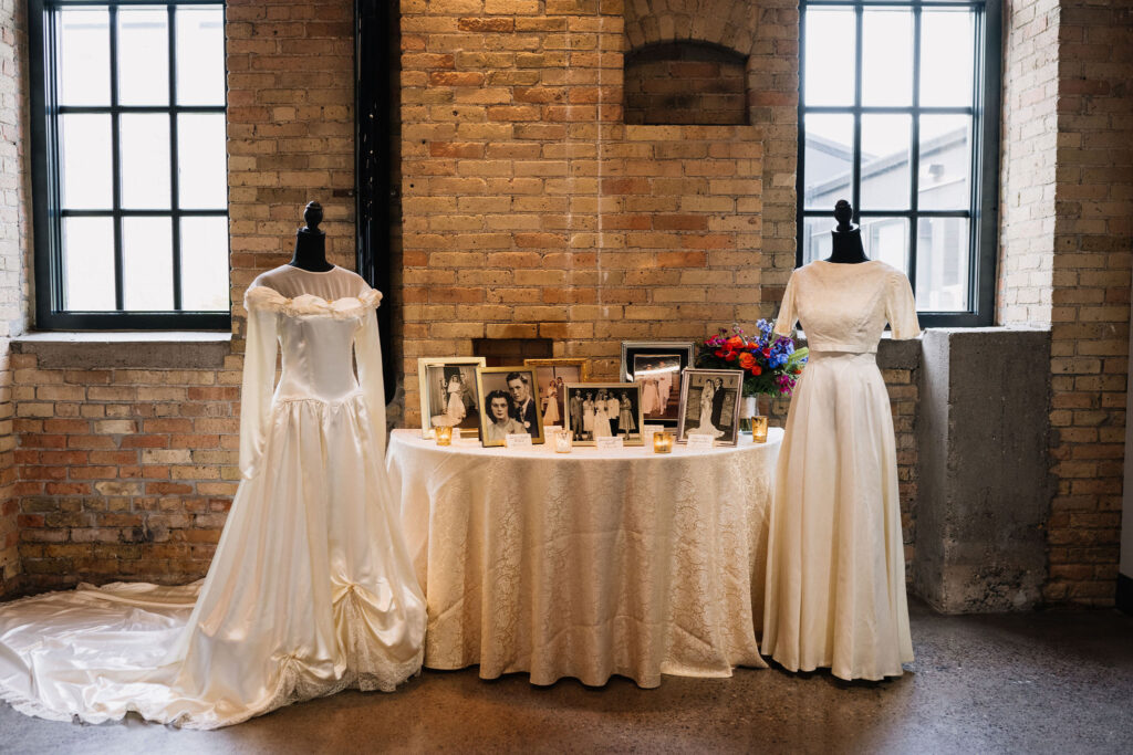 heritage table with old wedding dress display at Essence Event Center