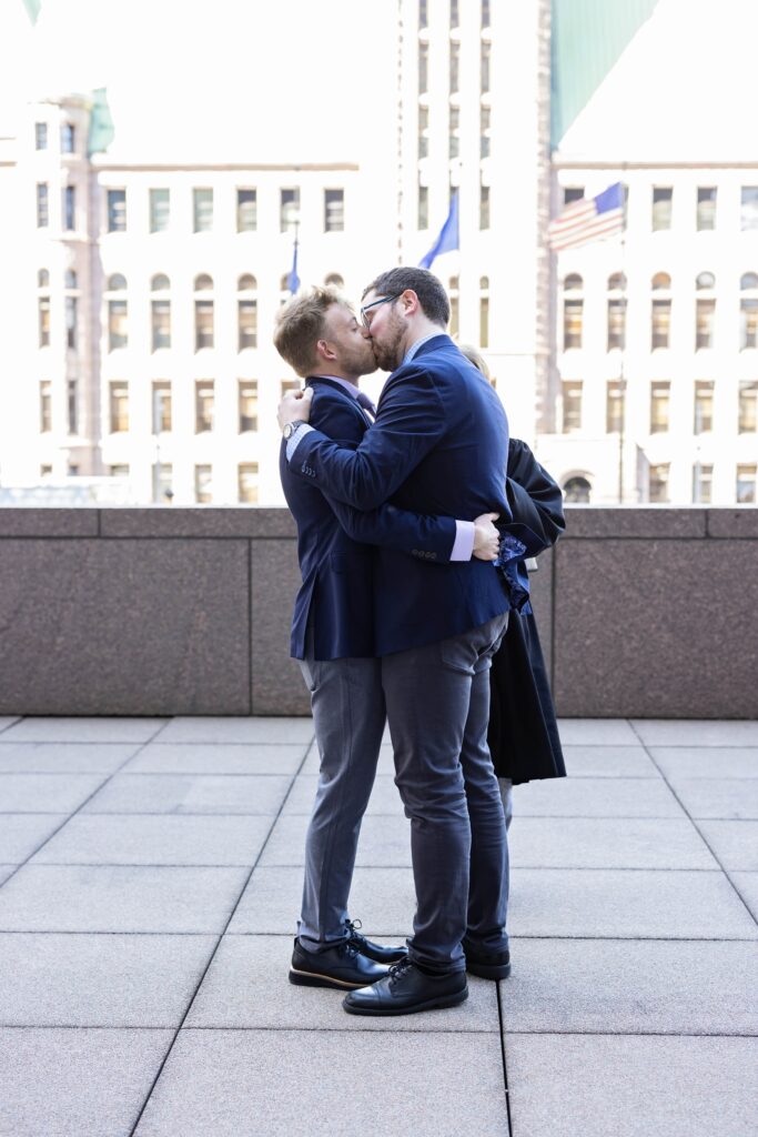 grooms kissing at court wedding in Minneapolis