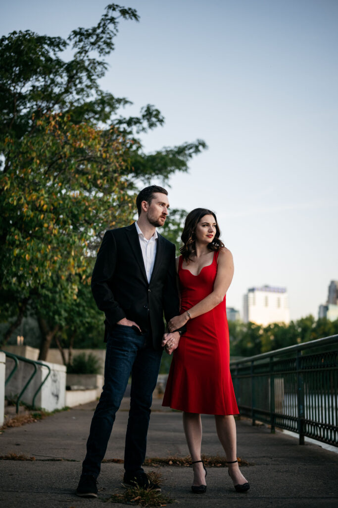 Couple dressed up in red dress and suit engagement photo