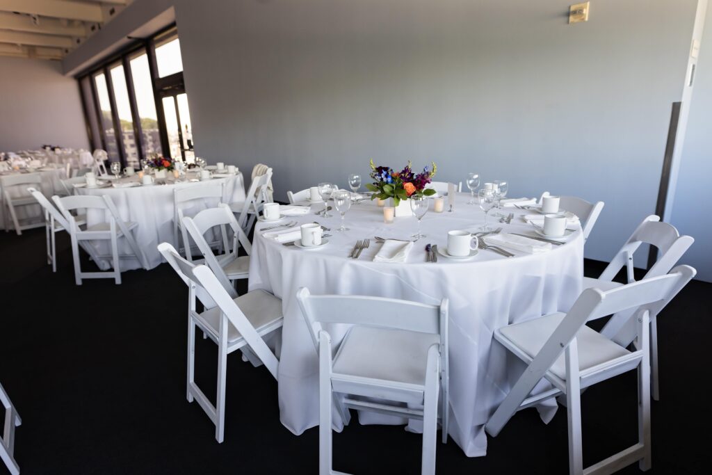 simple white wedding reception with colorful florals at walker art center wedding