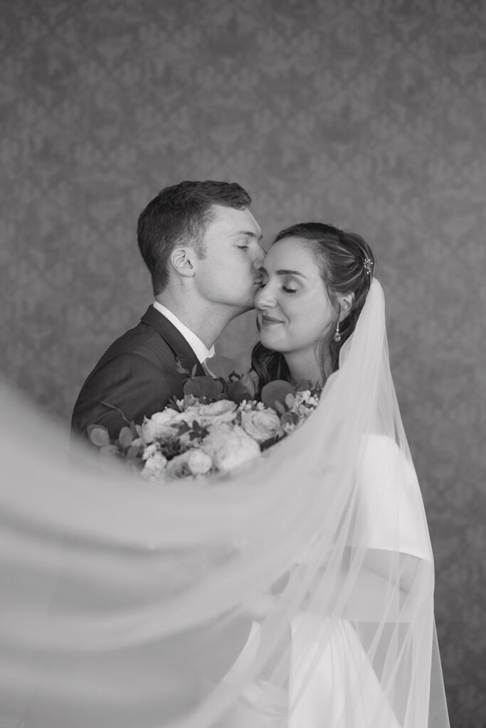 black and white couple portrait with veil