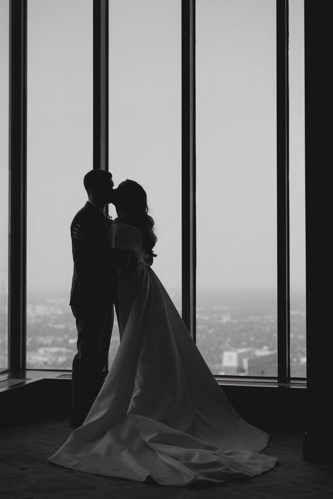 couple silhouette kissing on 50th floor of IDS Tower at Downtown Minneapolis Wedding